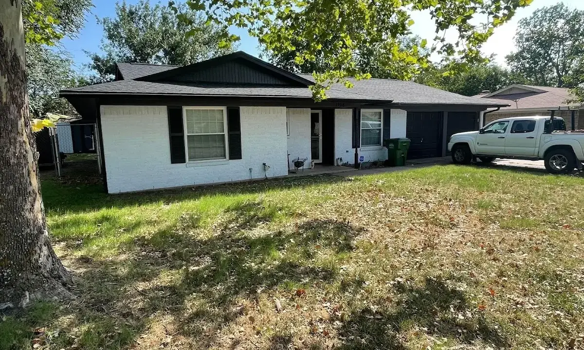 Professional roofing crew working on a residential roof in Moorefield
